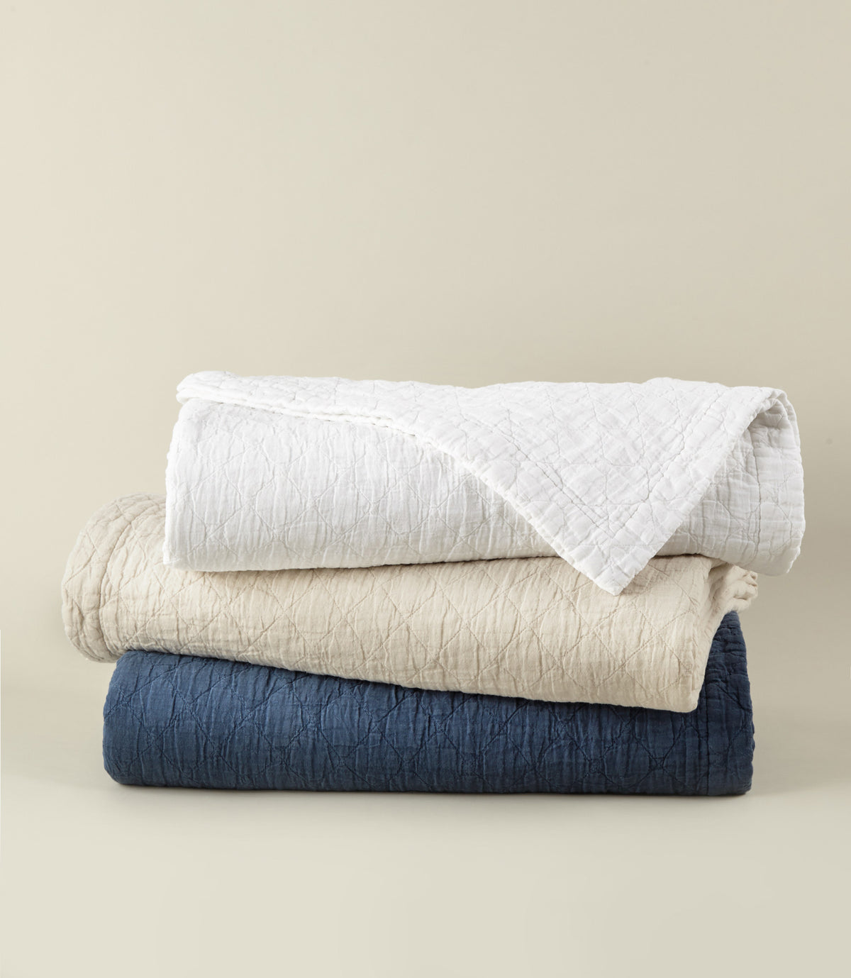 Heritage Stonewashed Coverlets stacked in White Natural Navy