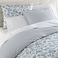 Highgrove Toile Duvet Set Highgrove Wedgewood on a bed with cream colored headboard