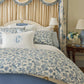 Highgrove Toile Reversible Duvet Set on a bed with a blue headboard and decorative curtains, Highgrove Wedgewood