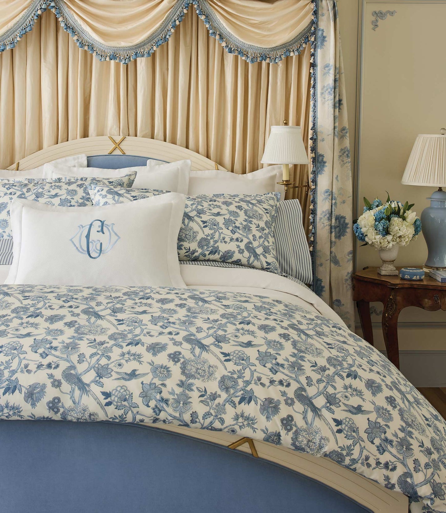 Highgrove Toile Reversible Duvet Set on a bed with a blue headboard and decorative curtains, Highgrove Wedgewood