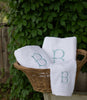 Jubilee Towel monogramed and displayed in a wicker basket, White