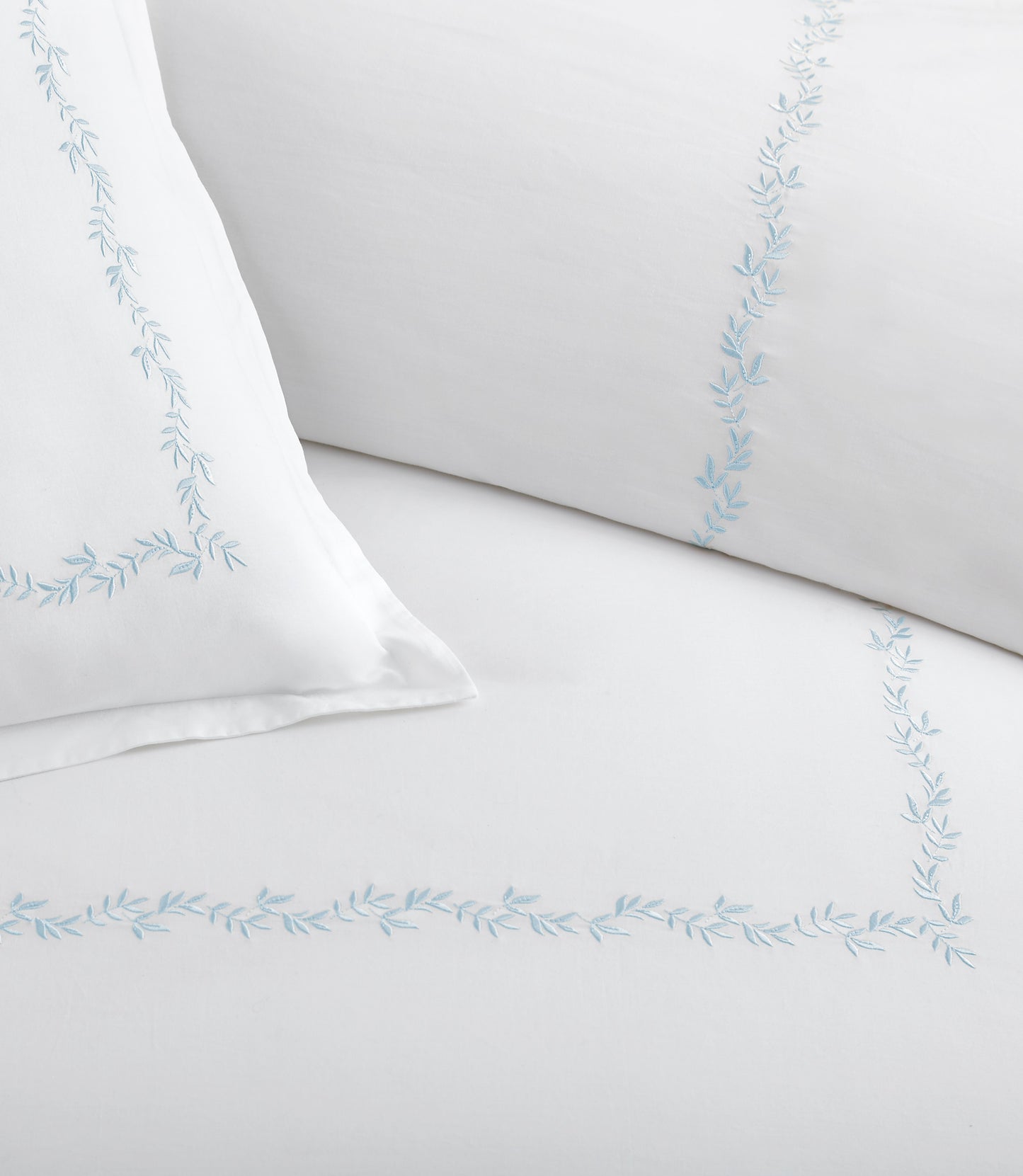 Close up of vine detailing on the Ivy Classic Embroidered Duvet Set, Sky
