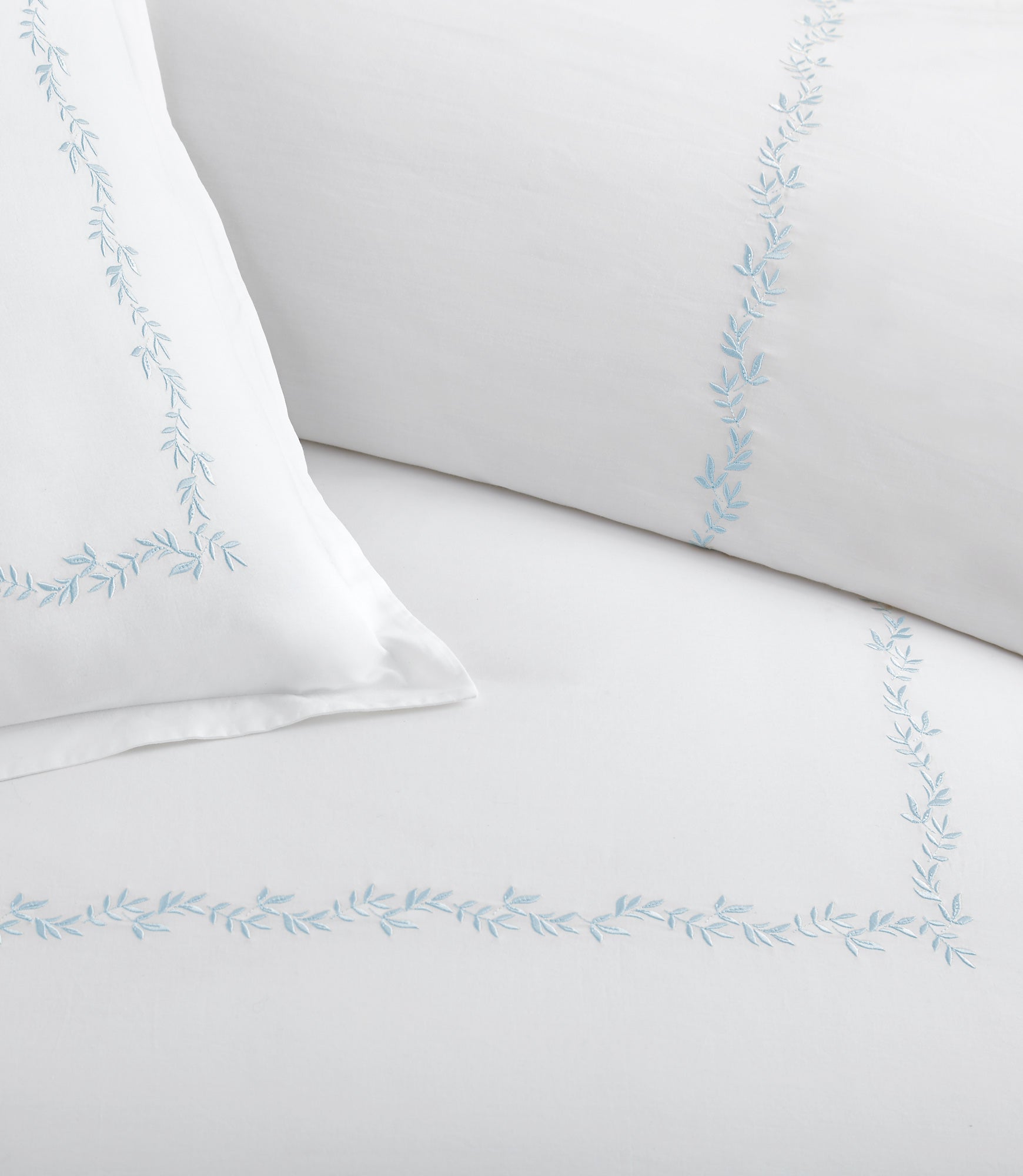 Close up of vine detailing on the Ivy Classic Embroidered Duvet Set, Sky