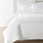 Ivy Classic Embroidered Duvet Set displayed on a bed with a cream colored headboard, Sky
