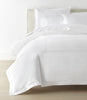 Ivy Classic Embroidered Duvet Set displayed on a bed with a cream colored headboard, White