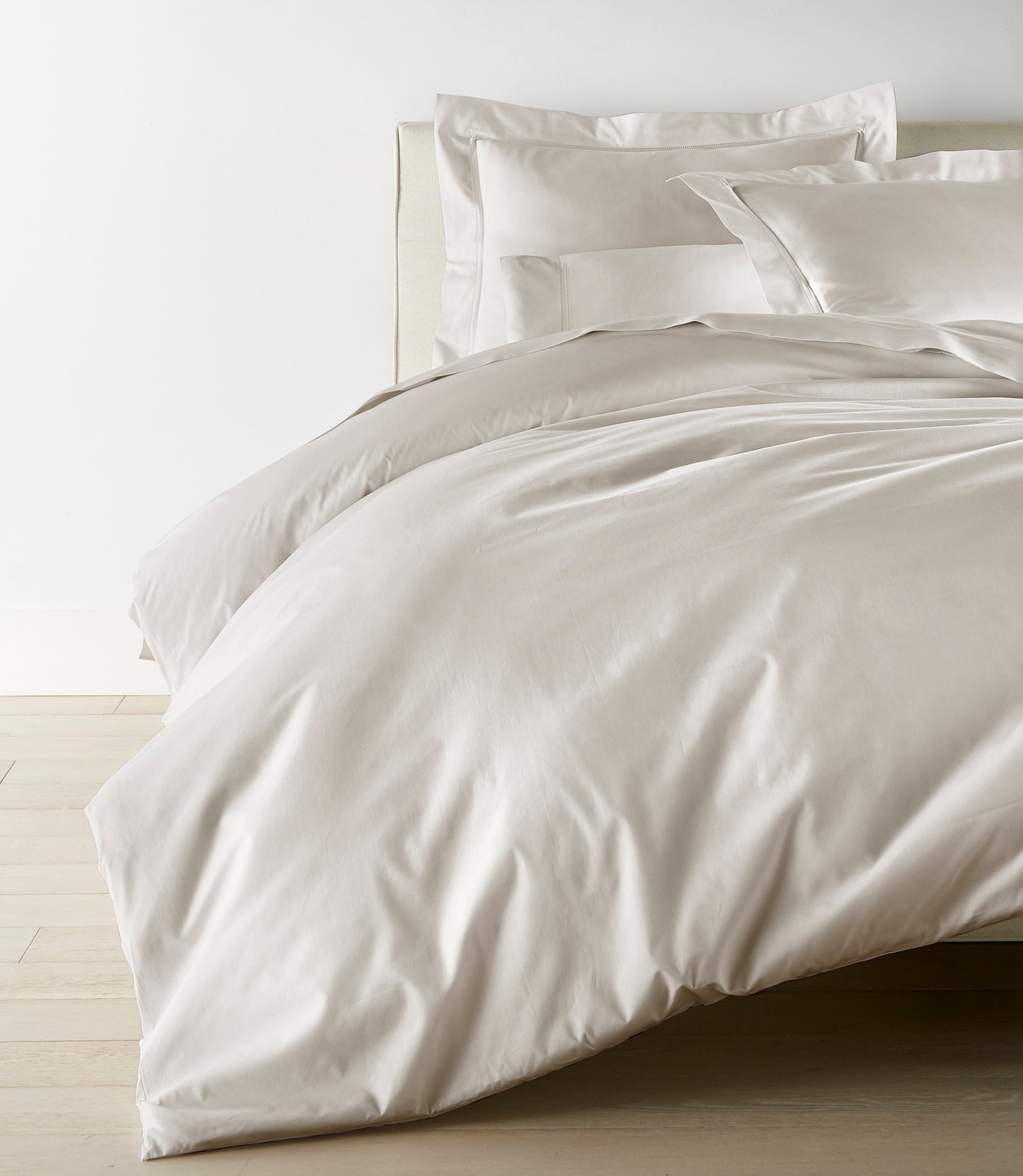 Lyric Duvet Cover and Shams on Bed in Platinum
