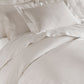 Lyric Duvet Cover and Shams on Bed in Platinum