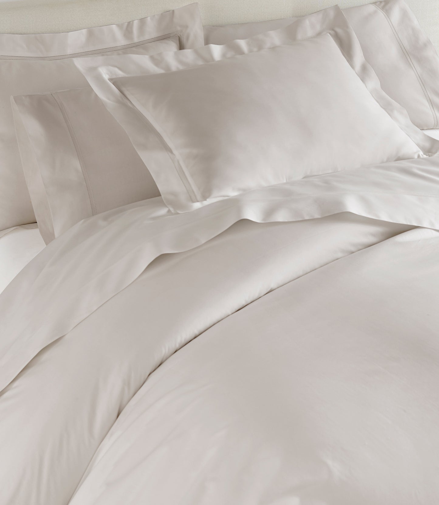 Lyric Duvet Cover and Shams on Bed in Platinum