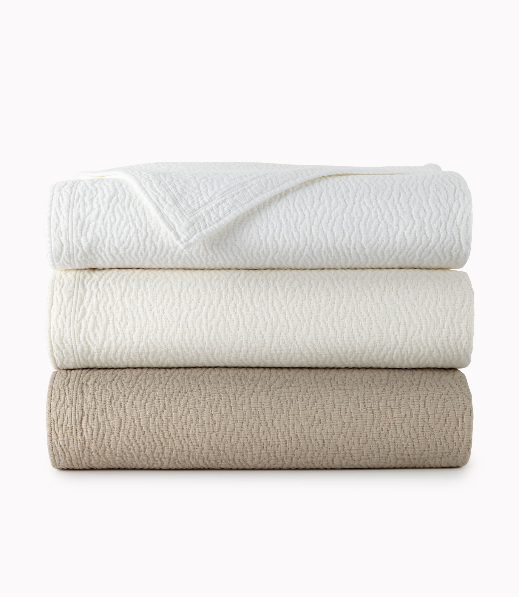 stack of Mia Coverlets in neutral colors, White Dune Pearl
