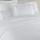 Mia Stonewashed Matelassé Shams on bed, White