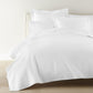 Montauk coverlet and shams on bed, White
