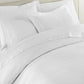 Montauk matelassé duvet cover and shams on bed, White
