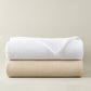 Stack of Riviera Blanket White Linen