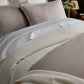 Savoy Jacquard Duvet Set styled on a bed, Platinum