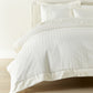Soprano Stripe Duvet Cover displayed on a bed with a cream colored headboard, Ivory