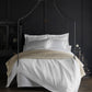 Soprano sateen bedding on bed in black room, White