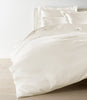 Lyric Duvet Cover and Shams on Bed in Ivory