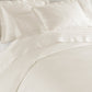 Lyric Duvet Cover and Shams on Bed in Ivory