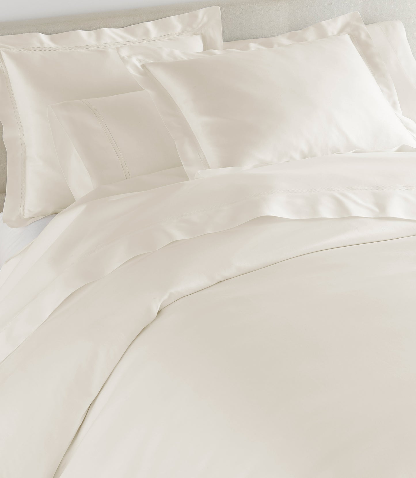 Lyric Duvet Cover and Shams on Bed in Ivory