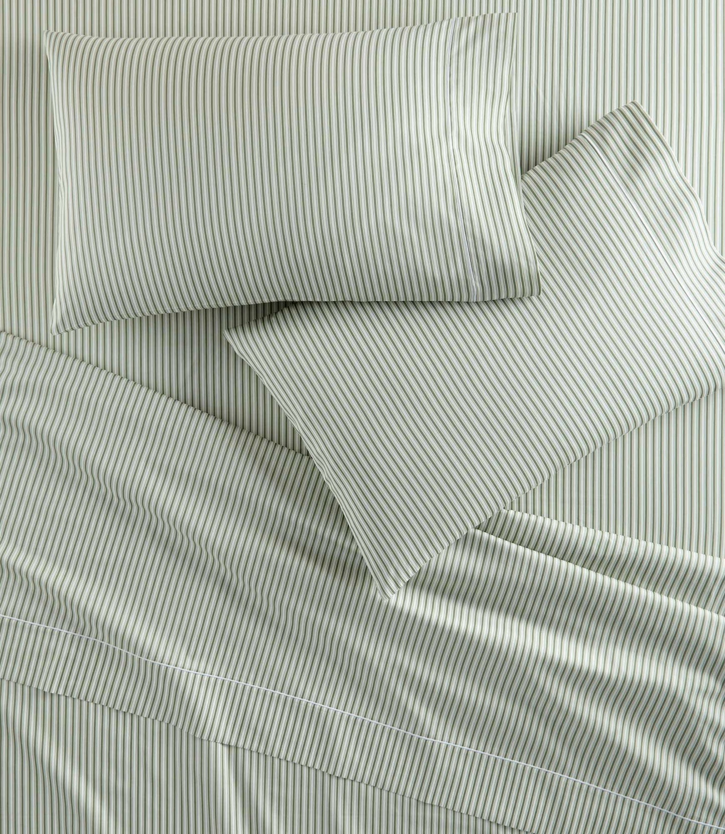 Windsor Stripe Pillowcases on bed, Stripe Moss