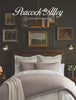 Moody bedroom scene Peacock Alley Luxury Linens logo overlaid at the top.