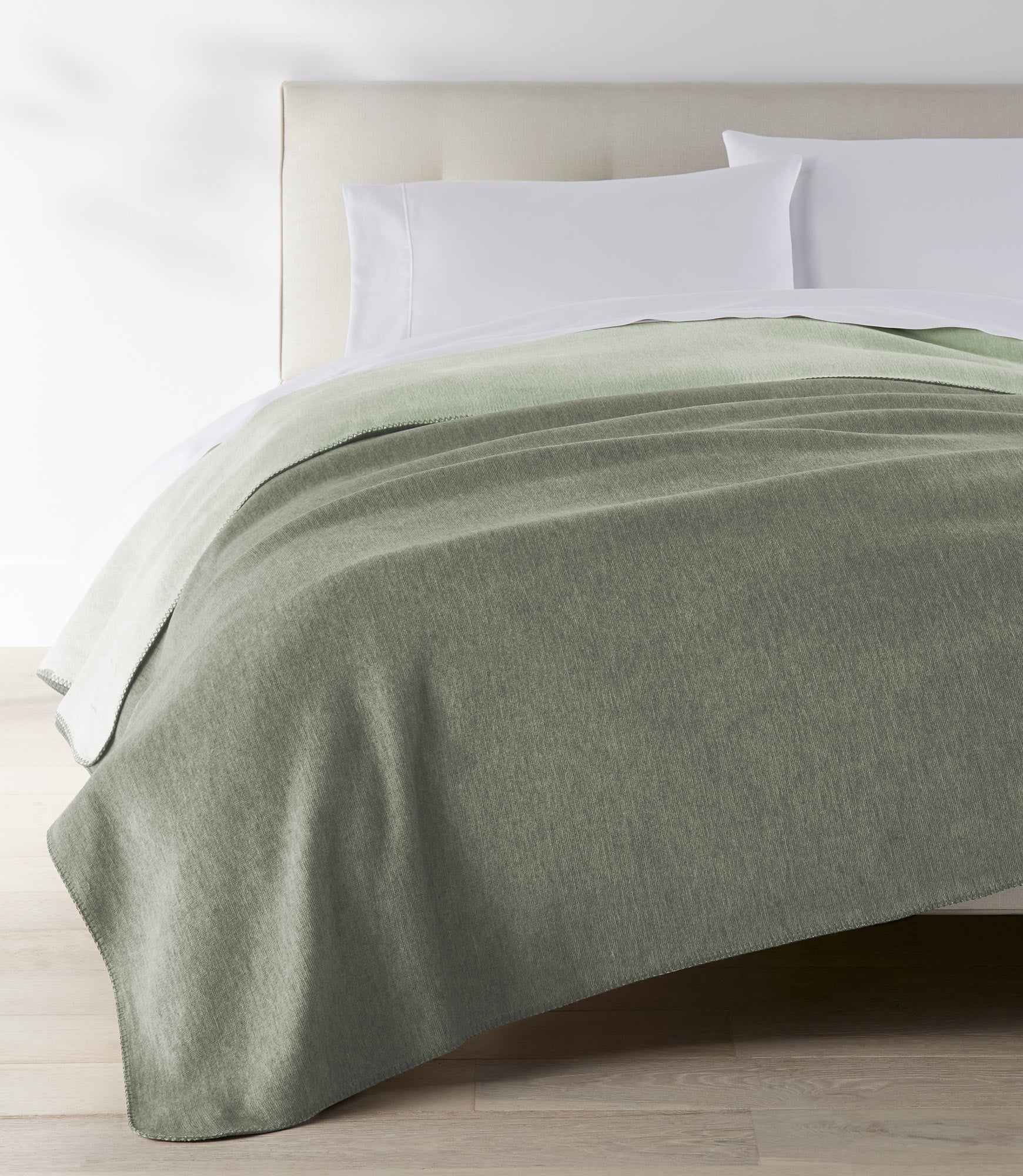 Alta Reversible Cotton Blanket Basil on White Bed
