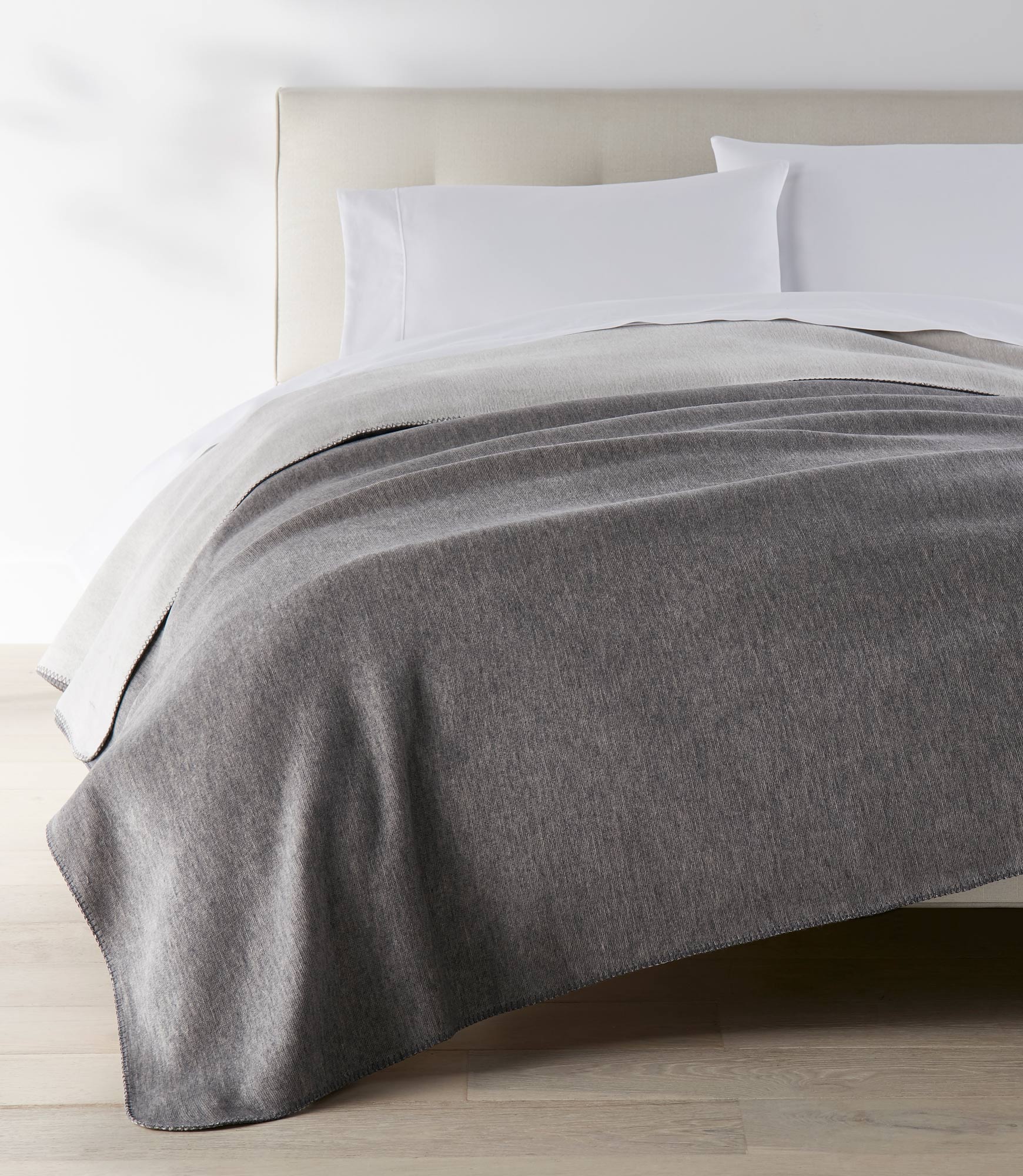 Alta Reversible Cotton Blanket Gray on White Bed