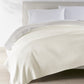 Alta Reversible Cotton Blanket Pearl on White Bed