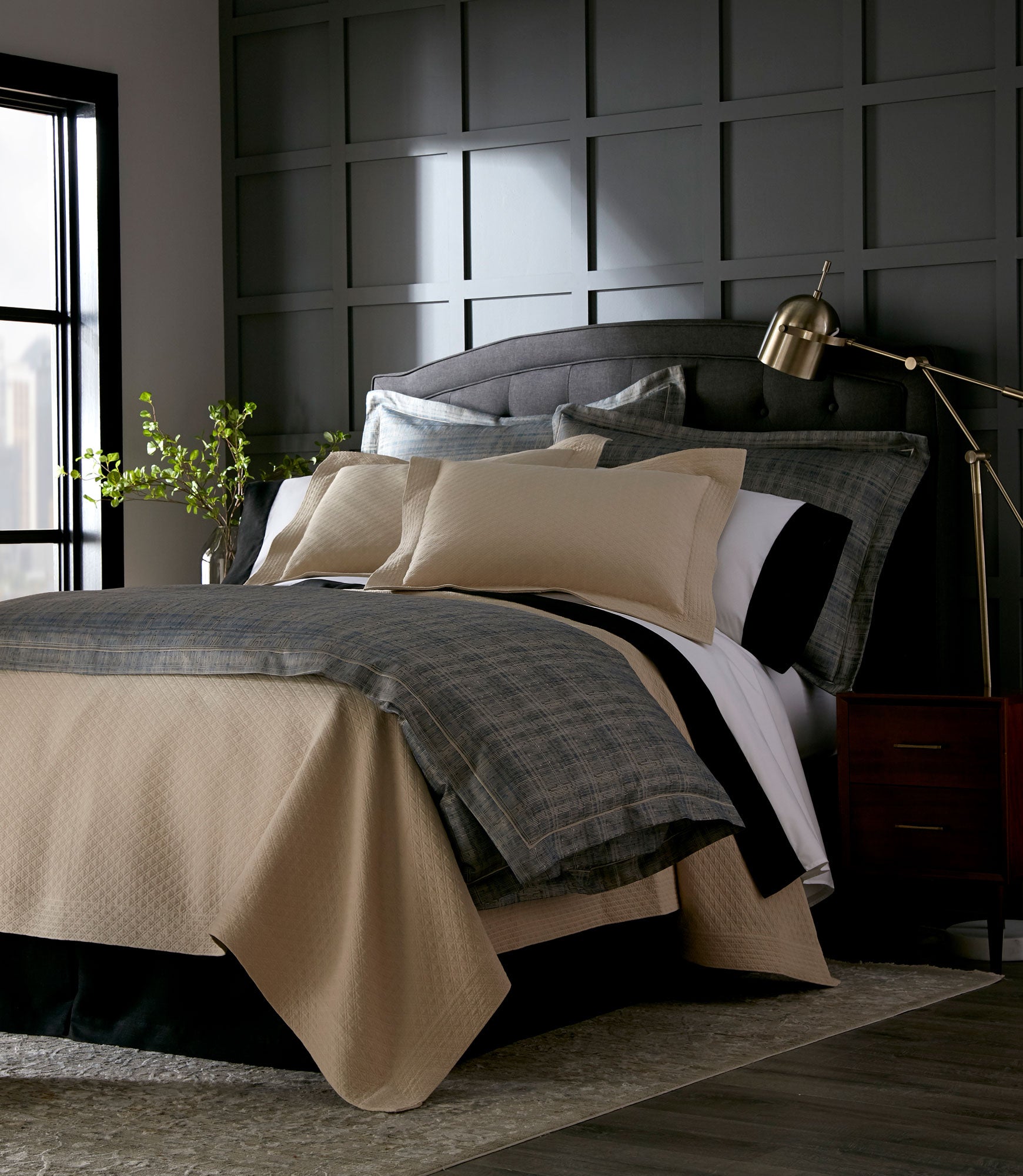 Alyssa Coverlet and Sham Flax  on a Bed in a Black Room