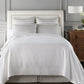 Angelina Matelassé Coverlet White on Bed in Hotel Room