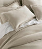 Angie Stonewashed Matelasse Shams on bed Dune