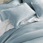 Angie Stonewashed Matelasse Shams on bed Smokey Blue