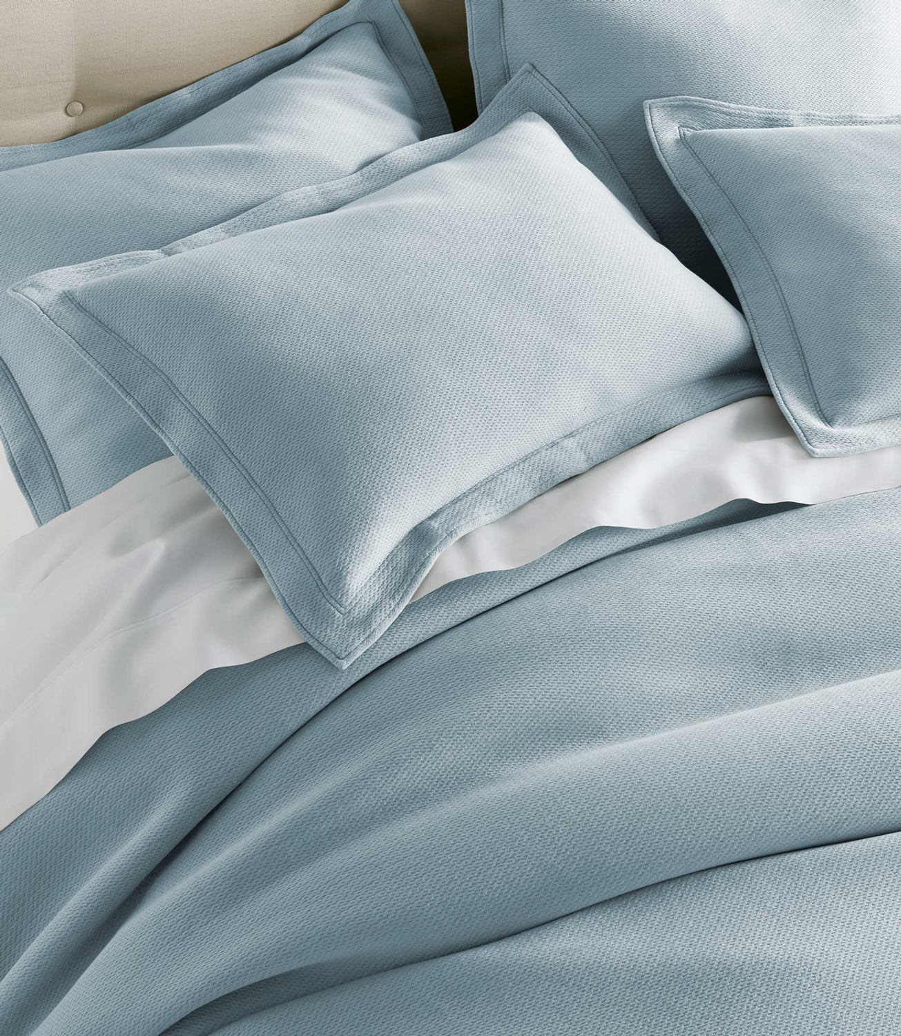 Angie Stonewashed Matelasse Shams on bed Smokey Blue