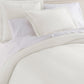 Angie Stonewashed Matelasse Shams on bed Pearl