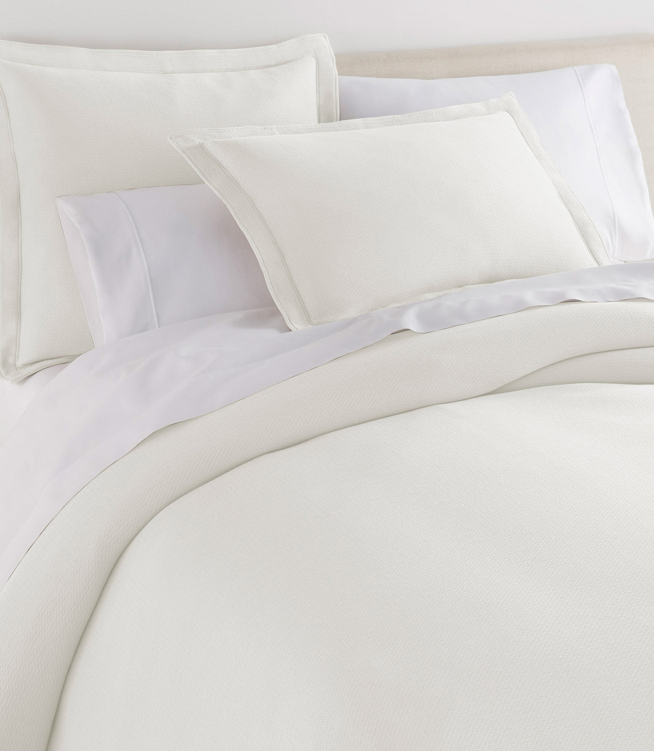 Angie Stonewashed Matelasse Shams on bed Pearl