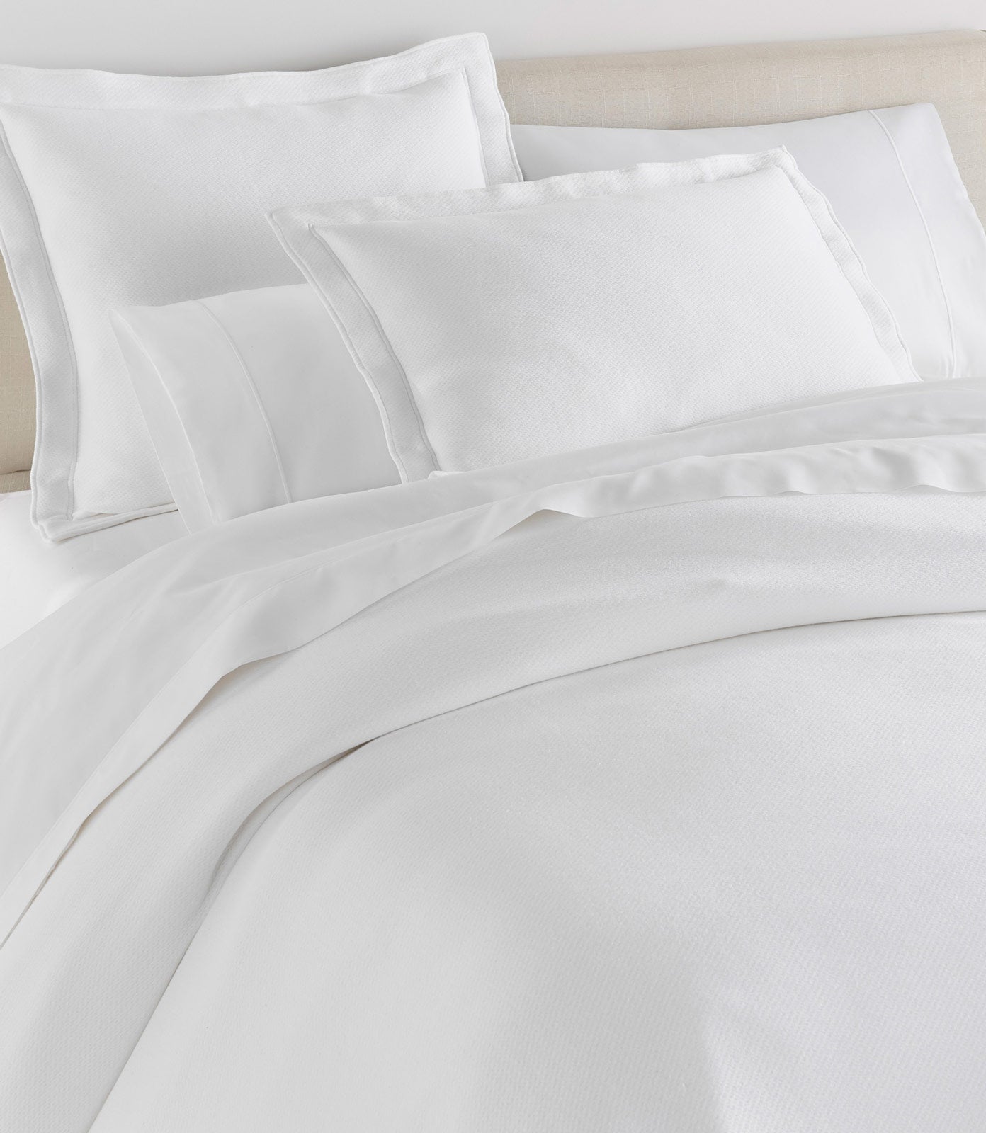 Angie Stonewashed Matelasse Shams on bed White