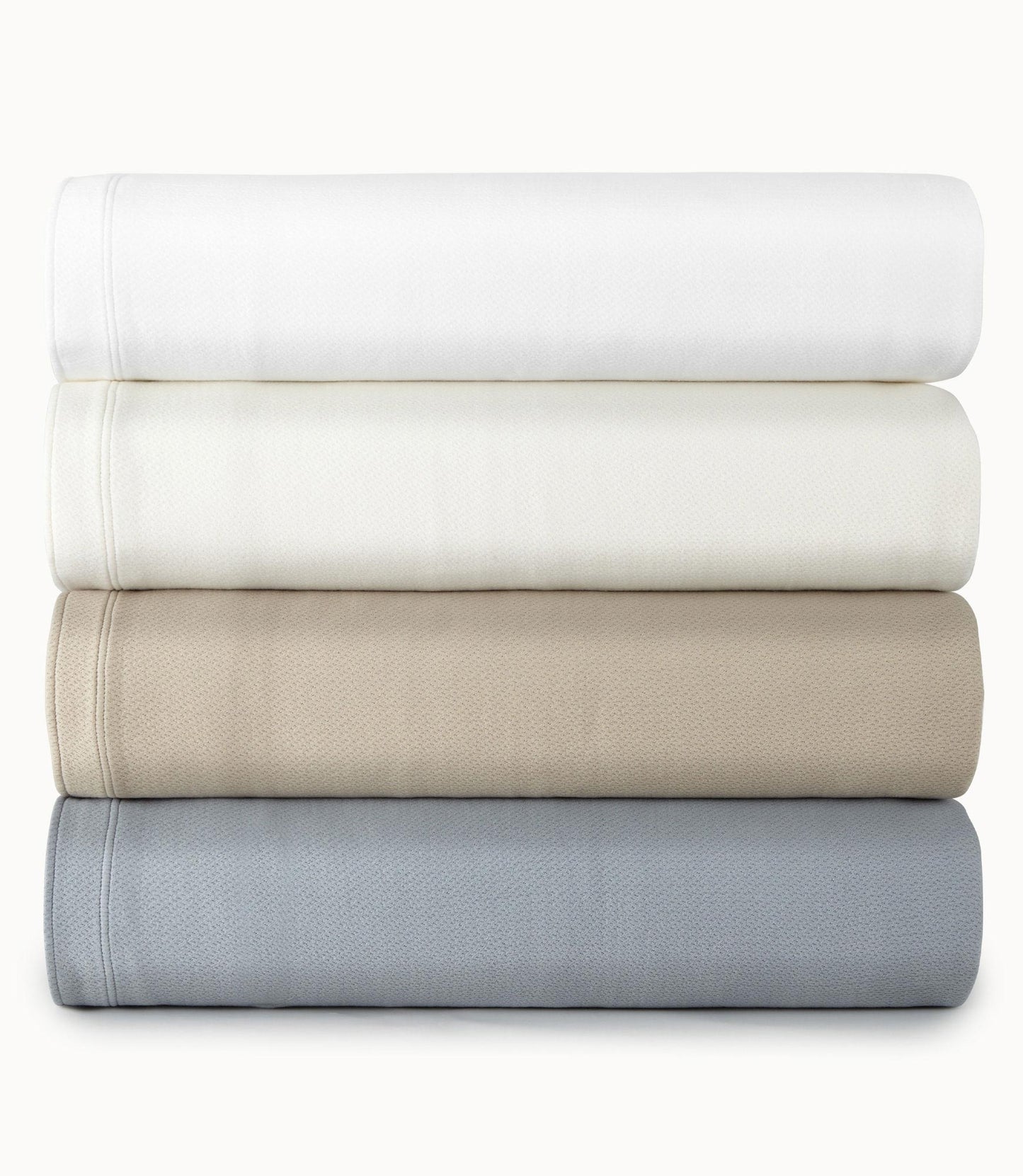 Angie Matelasse Coverlet folded stack in various colors White Pearl Dune Smokey Blue