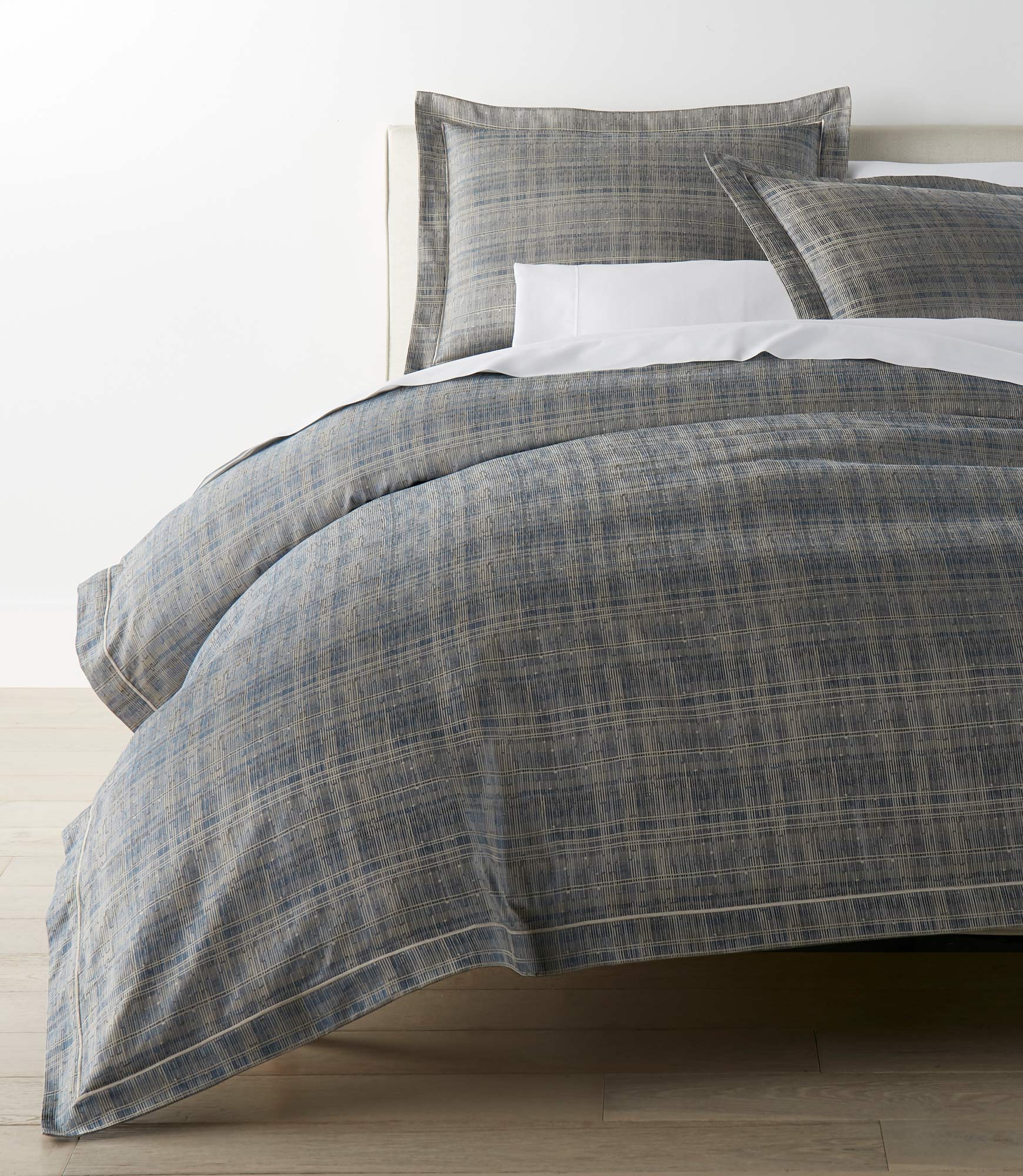 Biagio Blue Duvet Cover on a Bed