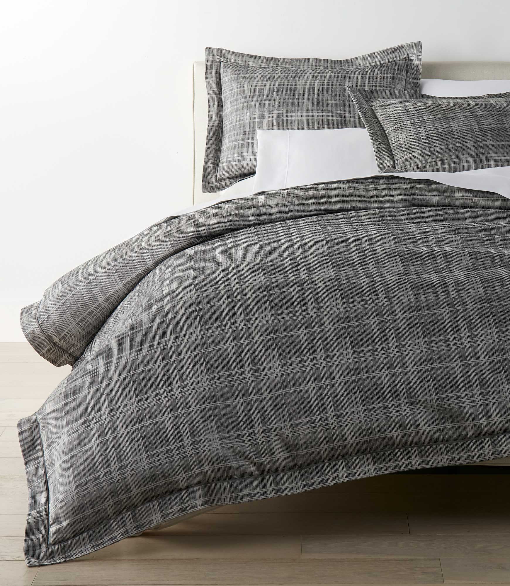 Biagio Charcoal Duvet Cover on a Bed