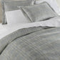 Biagio Jacquard Shams on bed Aloe