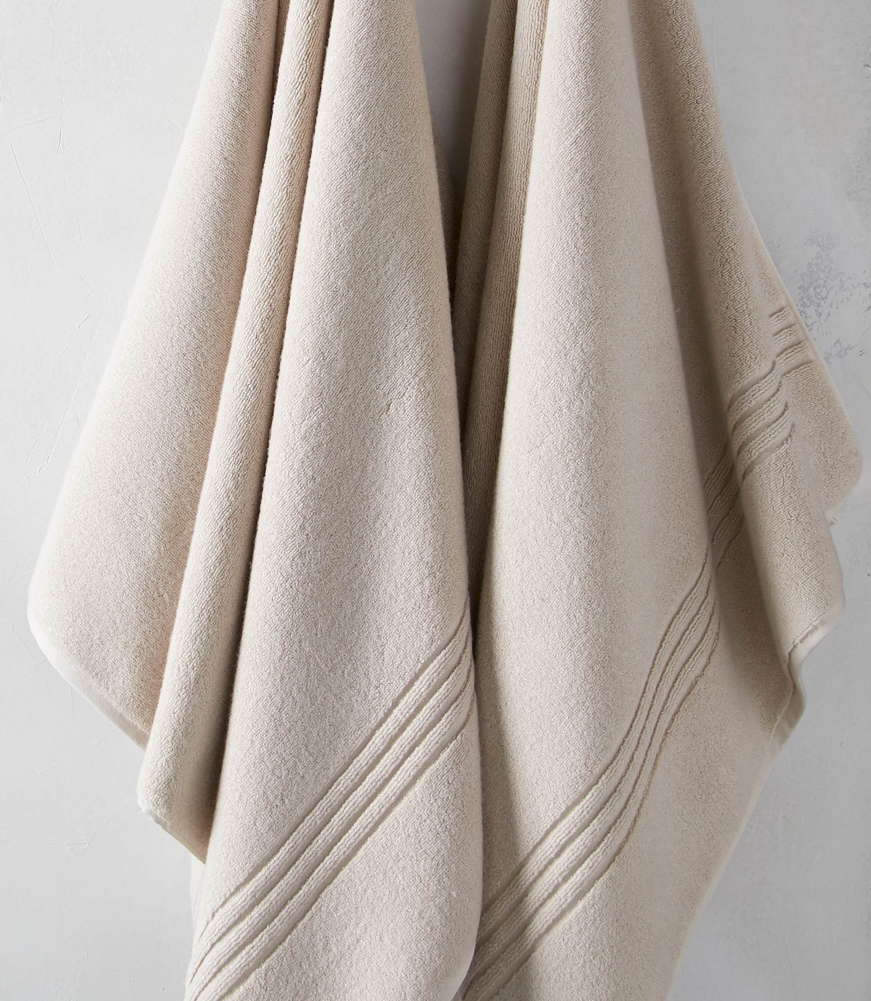 Chelsea Plush Bath Towel in Neutral Colors Hanging 