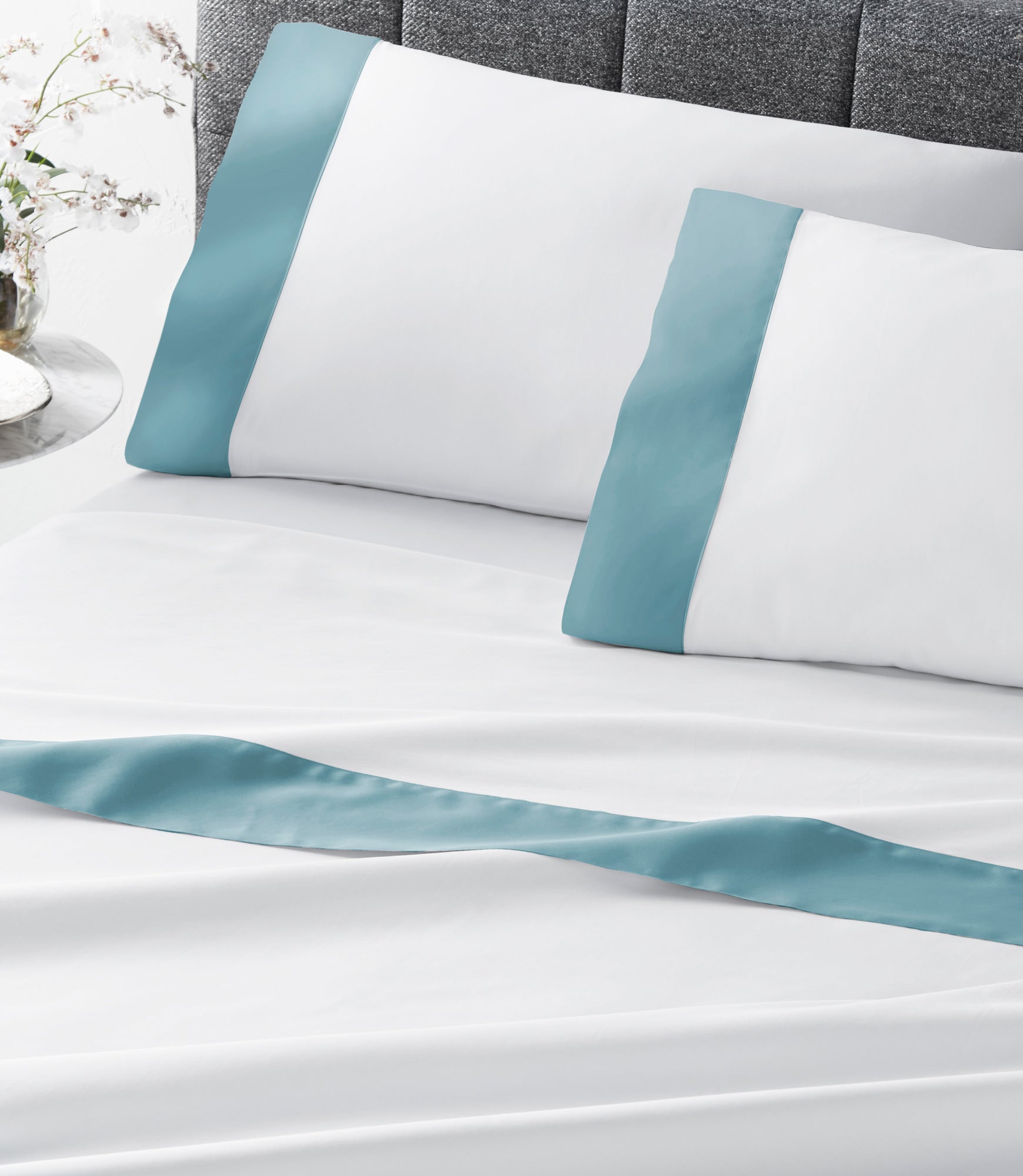 Modern Cuff Sateen Sheet Set Lagoon on Bed