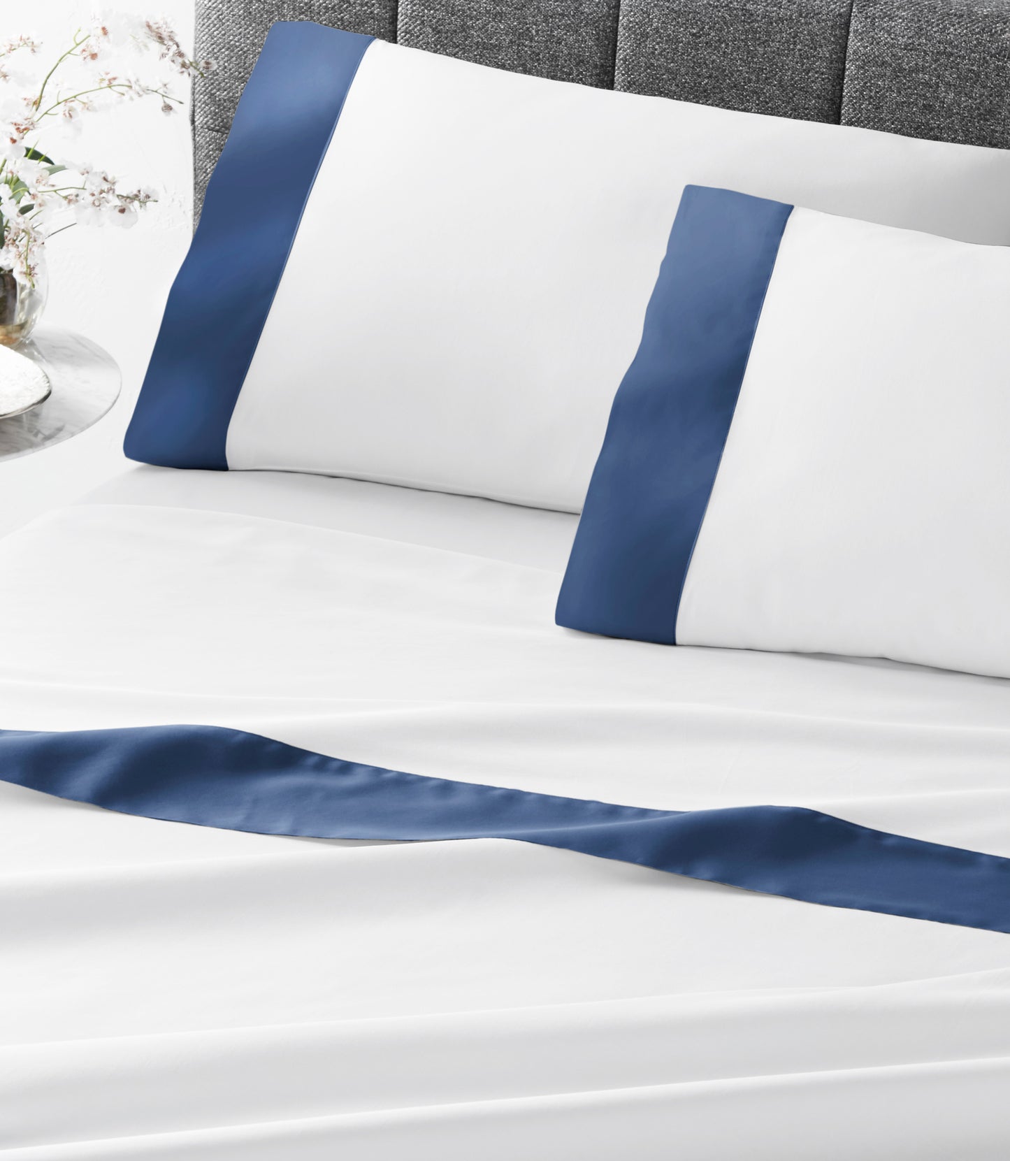 Modern Cuff Sateen Sheet Set Marine on Bed