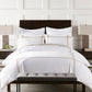 bed with striped shams and duvet cover Linen