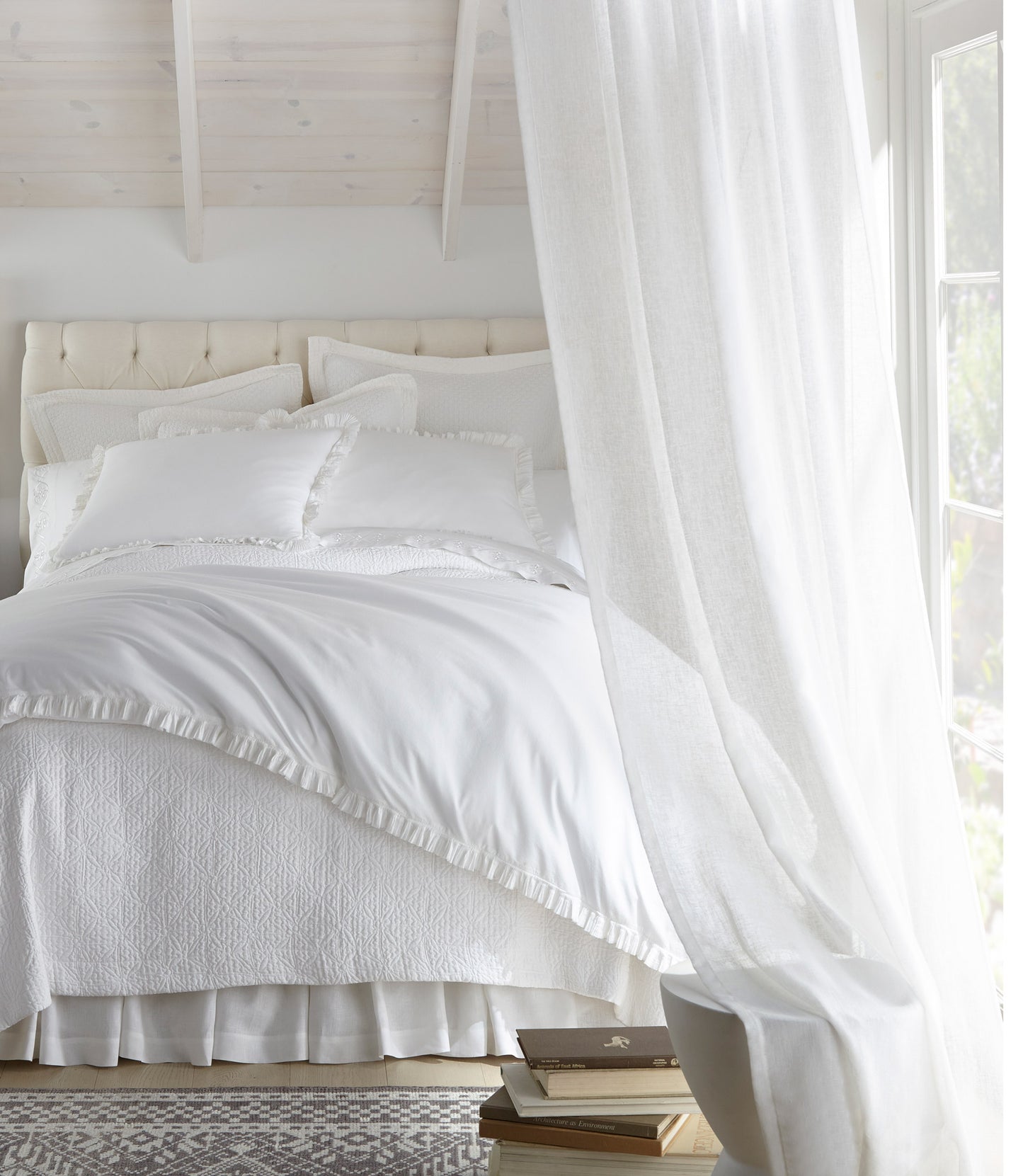all white bedding with Ellie ruffled pillow shams