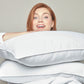 woman holding goose down pillow inserts