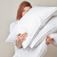 woman holding white goose down bed pillow inserts