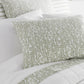 Fern Percale Sleeping Shams  Olive on Bed