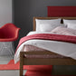 Grid Berry Duvet Cover and Shams on Bed