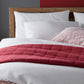 Grid Berry Duvet Cover and Shams on Bed
